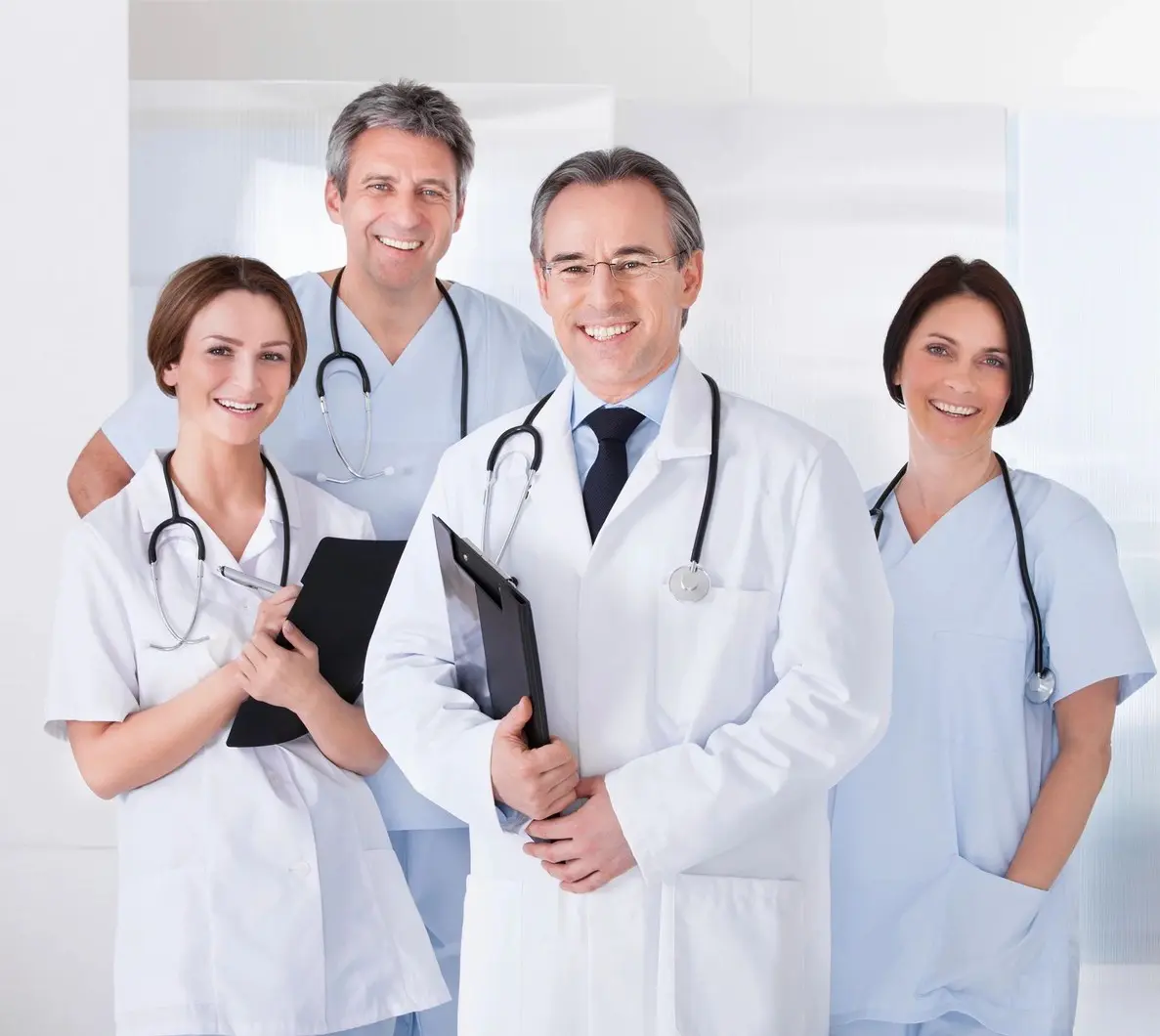 A group of doctors standing in a room.